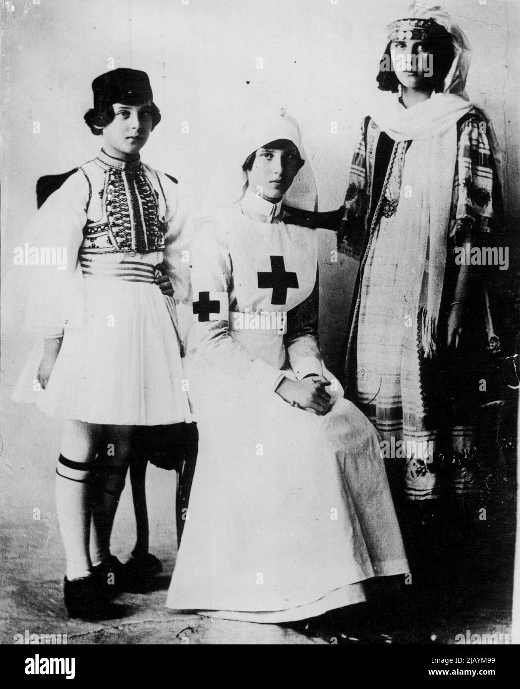 Princess Marina In Fancy Dress -- L to R) Princess Marina as a Grecian soldier, with ***** sisters, Princess Olga as a nurse and Princess Elizabeth gipsy girl. January 21, 1935. (Photo by Keystone). Stock Photo