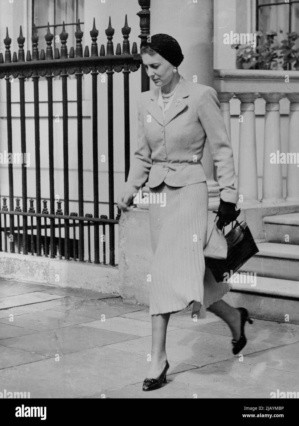 Duchess of Kent Leaves For Italian Royal Wedding -- The Duchess of Kent as she left No. 3, Belgrave Square for Hendon. The Duke and Duchess of Kent left their home in Belgrave Square, London, for Hendon Aerodrome, from where they left by air for Florence to attend the wedding of the Duke of Spoleto, son of King Victor Emmanuel of Italy, to Princess Irene of Greece. June 30, 1939. Stock Photo