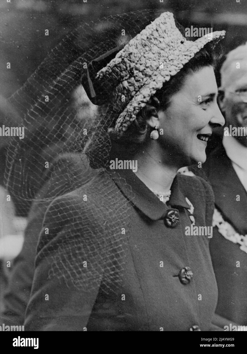 The Duchess of Kent's New Hat Fashion - A smiling close up picture of the Duchess and her charming hat fashion as she left the Cathedral after the service. The Duchess of Kent were a striking hat of natural straw decorated with a blue veil, when she visited Southwark to attend the service at Southwark Cathedral which inaugurated the Shakespeare Festival in the Borough. May 20, 1946. Stock Photo