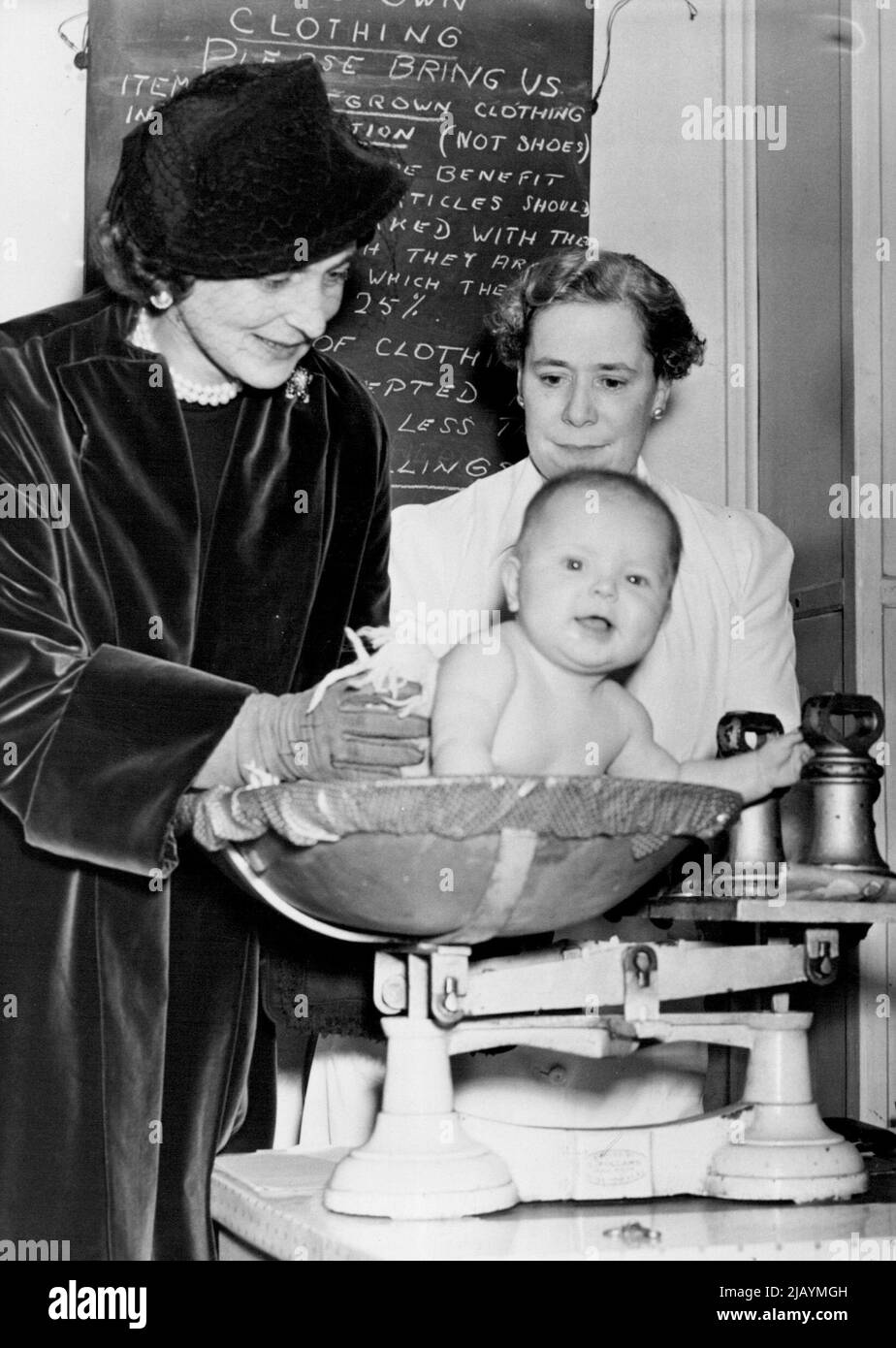 The Duchess of Kent Visits The Babies Club - During her visit to the Chelsea Babies Club, the Duchess of Kent weighed Laura Ann Dearborn, 6-months-old daughter of Mrs. Hamilton Dearborn, who is married to an American from Washington. Watching is a member of the Club Staff. HRH The Duchess of Kent today paid a visit to the Babies Club in Danvers Street, Chelsea, of which she is the President. Although an important day for them, many of the Club Members appeared distinctly unimpressed by the Royal visitor. October 31, 1951. (Photo by Fox Photos). Stock Photo