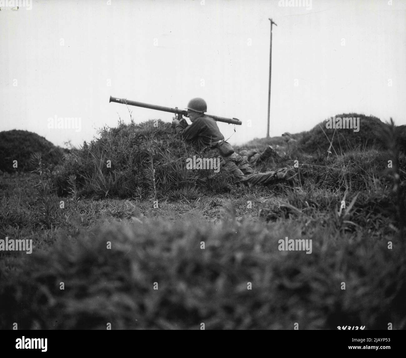 War In Korea -- A bazooka team fires against enemy tanks in the battle for South Korea. 2.36-inch Rocket Launcher 'Bazooka'. July 5, 1950. (Photo by U.S. Army Photograph). Stock Photo