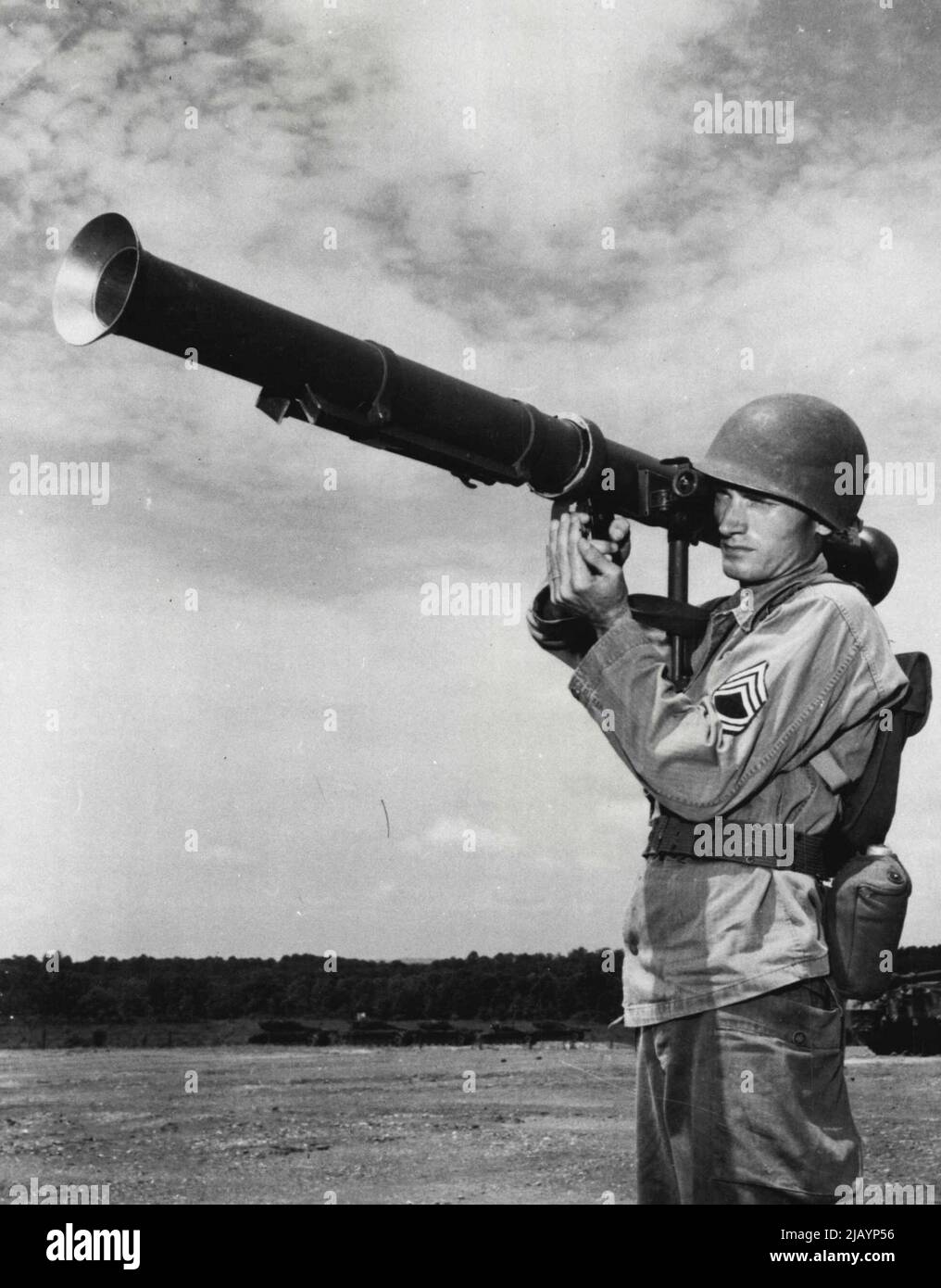 Sad Music For Tanks -- An infantry sergeant demonstrates the 3.5 Bazooka. Reports from the Korean battlefront have indicated that the smaller Bazookas were not effective enough when pitted against the Russian-Built heavy tanks. July 18, 1950. (Photo by U.S. Army Photo). Stock Photo