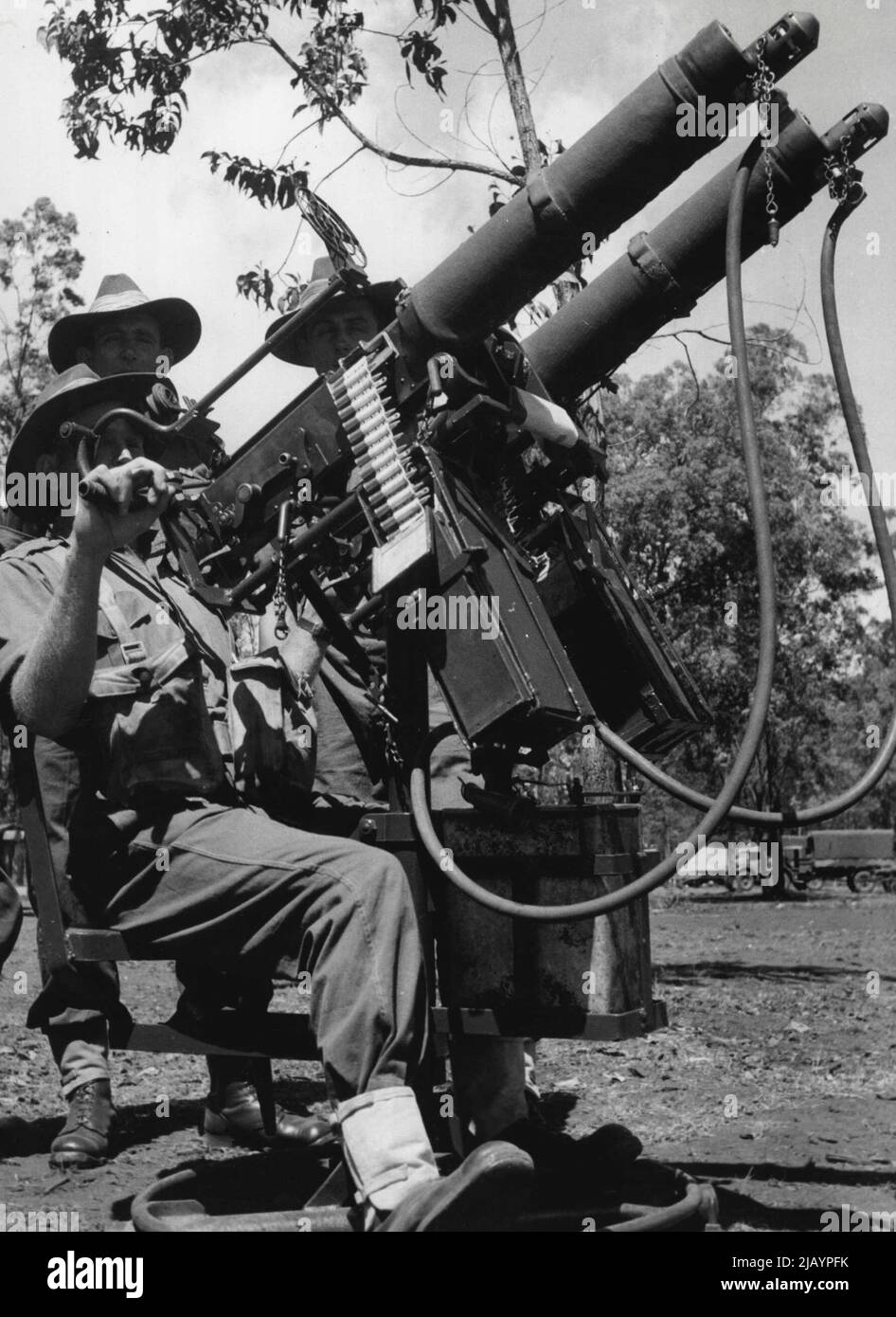 Members of a machine-gun unit man twin vickers on a radial ack-ack mounting. December 18, 1944. (Photo by Australian Official Photo). Stock Photo