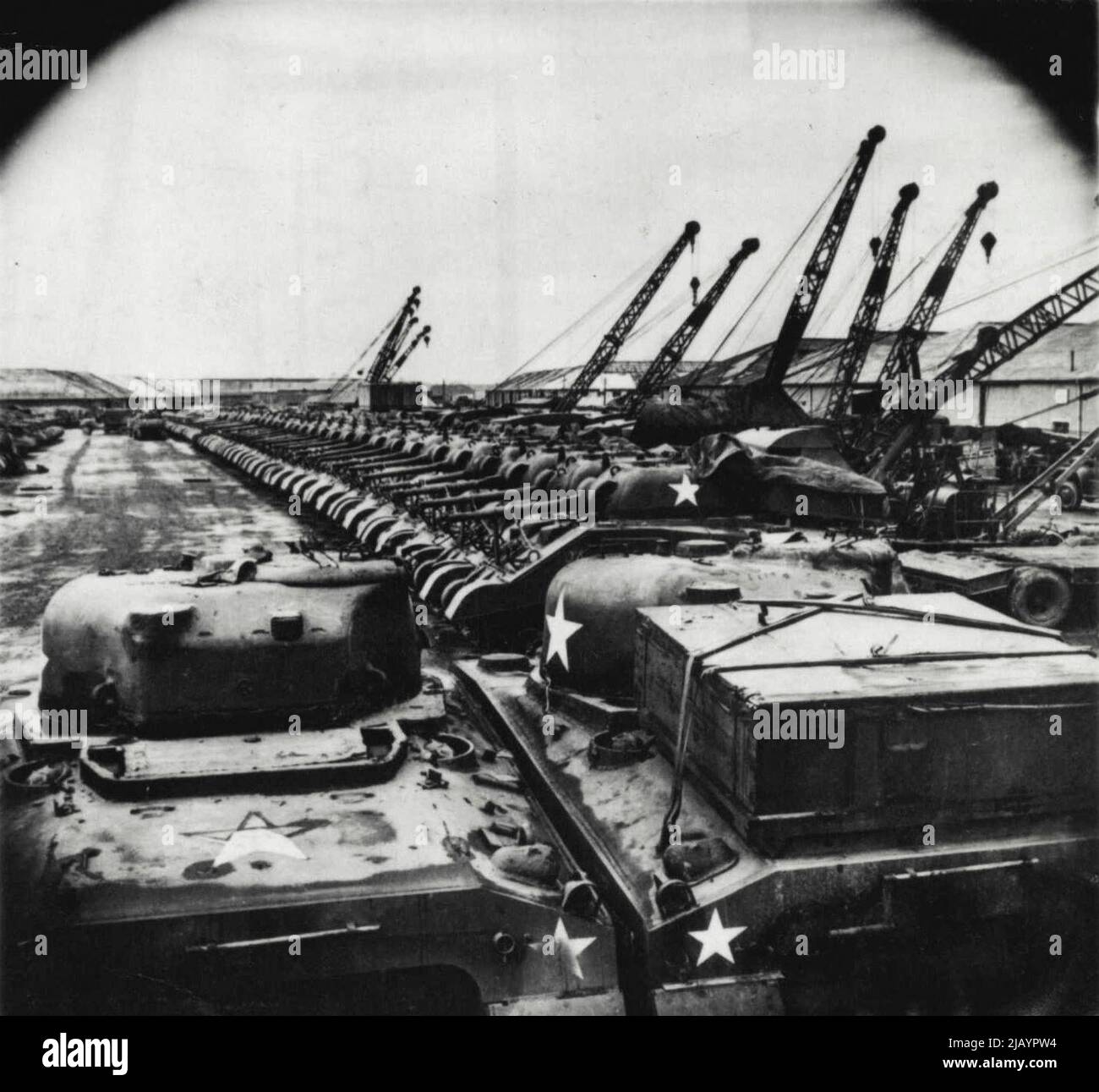 This general view of a tank park in an Ordnance depot in England shows a line of Sherman tanks and tank destroyers, part of the concentrated invasion supply power. February 26, 1944. (Photo by Associated Press Photo). Stock Photo