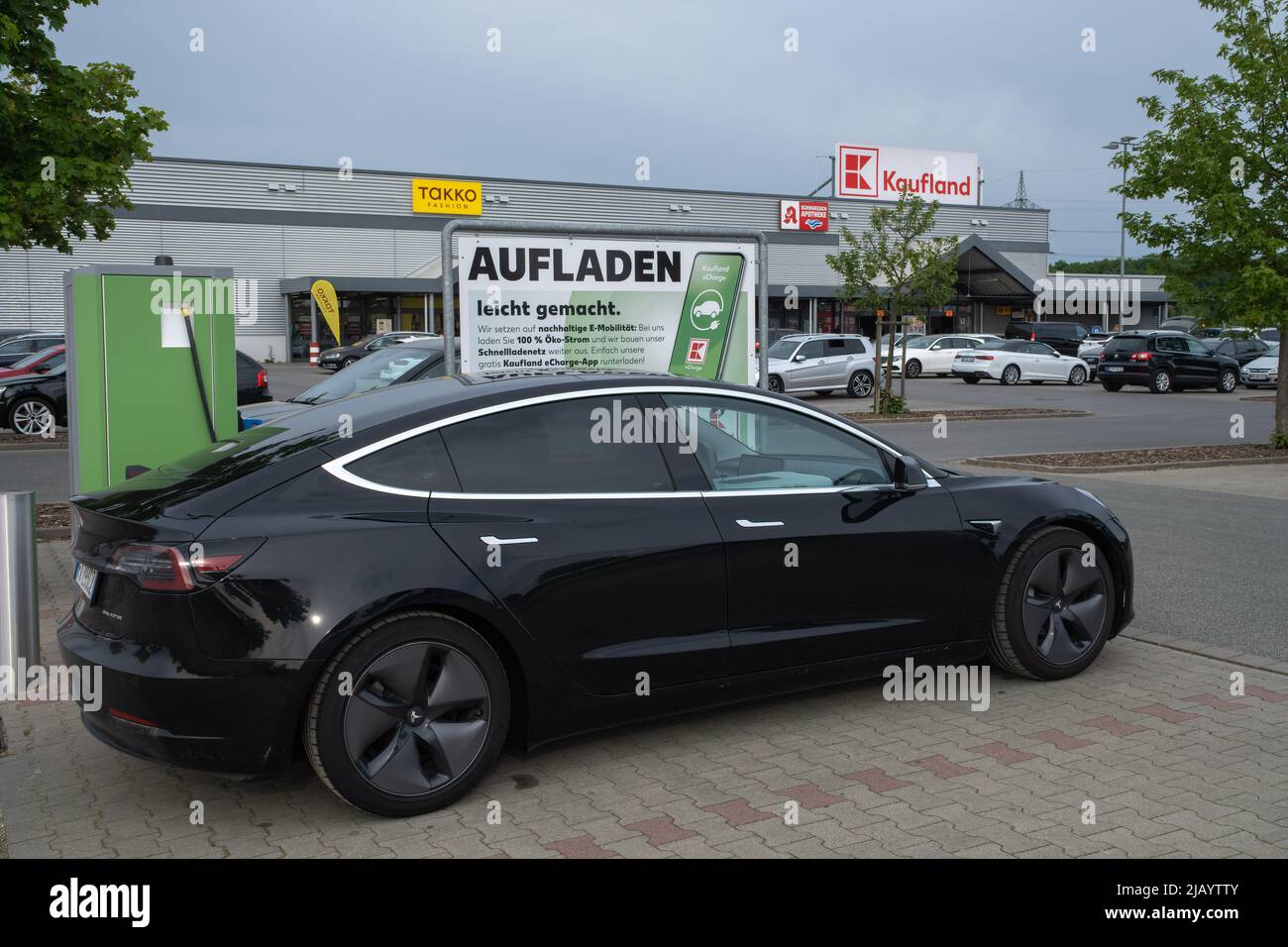 Wendelstein, Germany - May 16, 2022: A static shot of a solid black Tesla  Model 3 dual motor charging at the Kaufland supermarket DC charging station  Stock Photo - Alamy