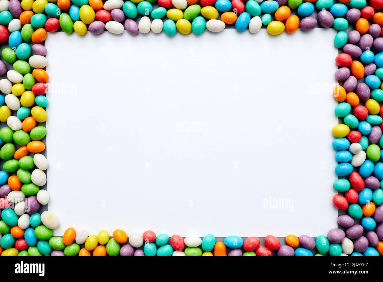 Jelly bean frame with blank paper sheet, copy space Stock Photo Alamy