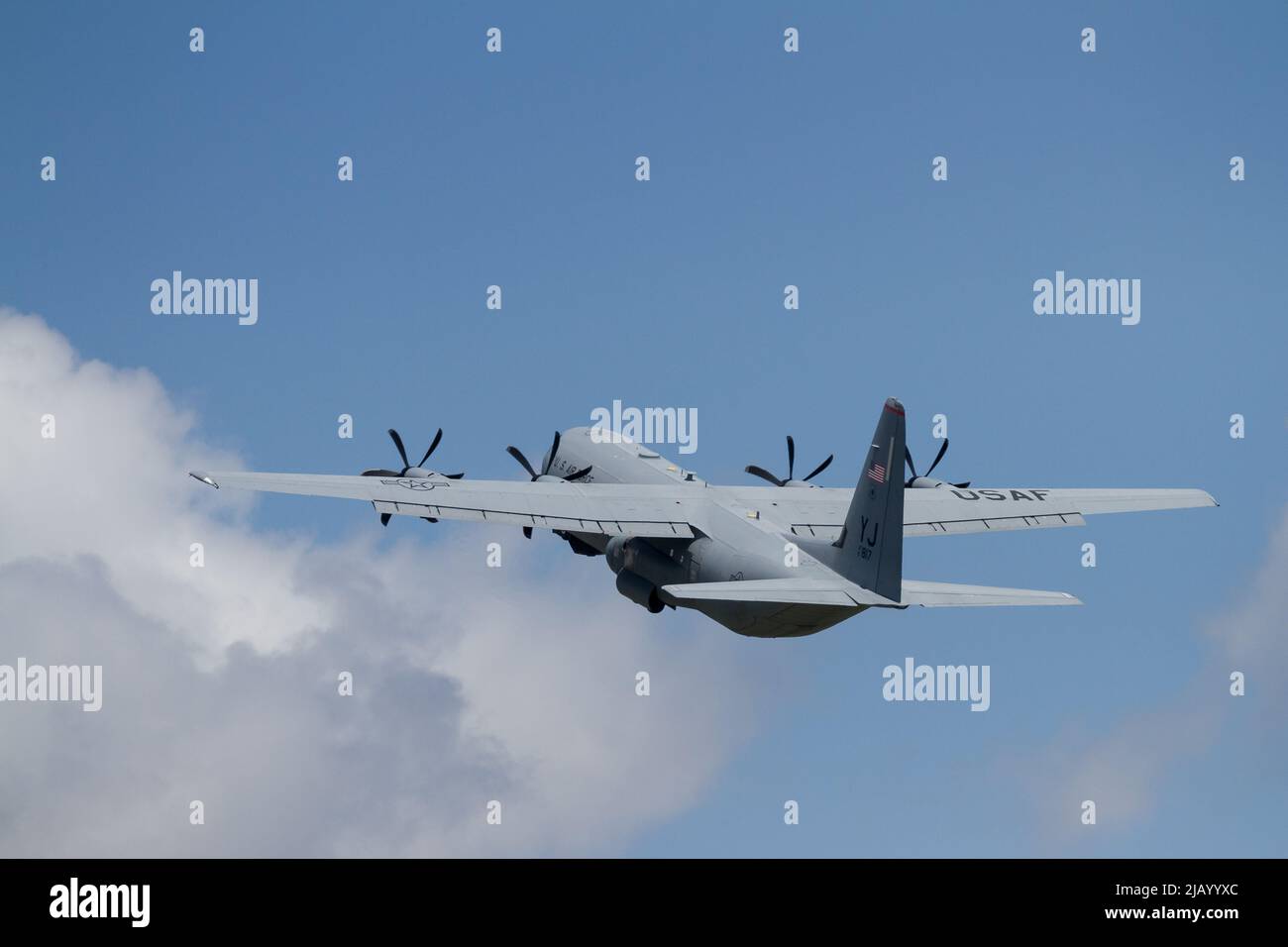 A Lockheed Martin C130-J Hercules with the United States Air Force taking off from Yokota Airbase, Fussa, Tokyo, Japan. Stock Photo