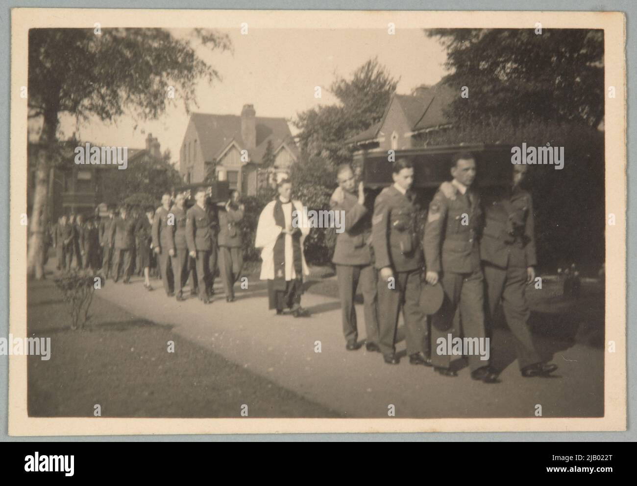 Priest and soldiers in a funeral conduct on the way to the Oaston Road