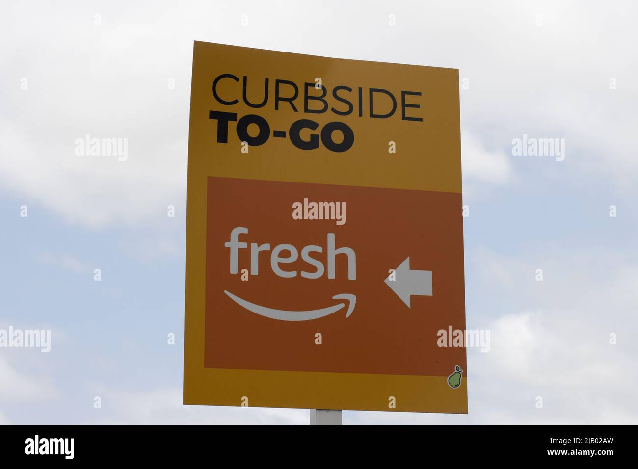 Curbside To-Go directional sign is seen in the parking lot outside an Amazon Fresh grocery store in Irvine, California, on Sunday, May 8, 2022. Stock Photo