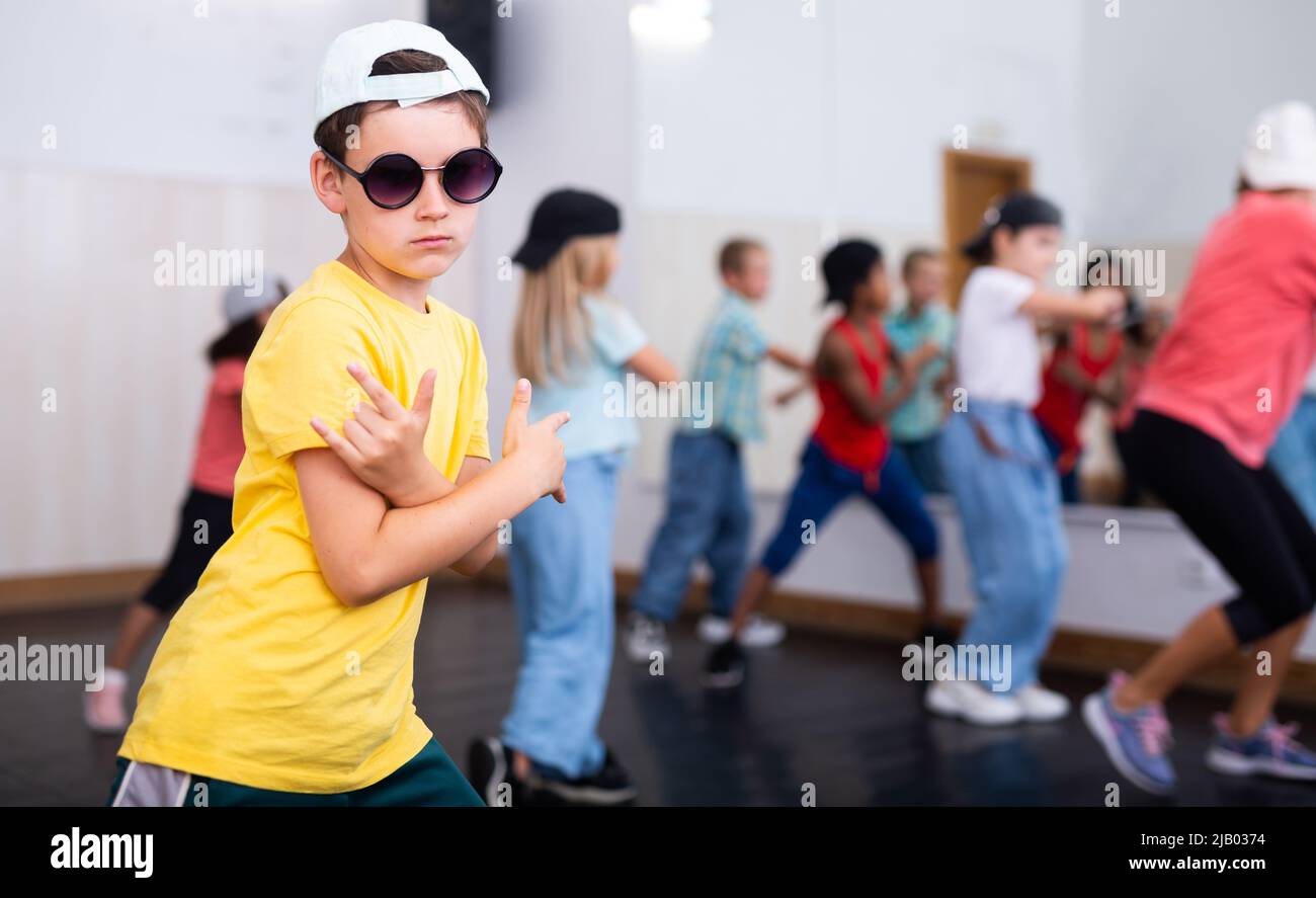 Tween boy hip hop dancer posing during group class Stock Photo - Alamy