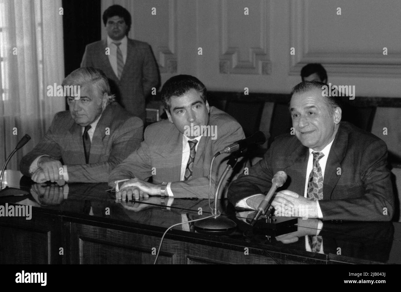 Bucharest, Romania, 1990. The President of the Romanian Football Federation, Mircea Angelescu, with politicians Petre Roman & Ion Iliescu, during a press conference following the qualification of the national football team to the 1990 FIFA World Cup. Stock Photo