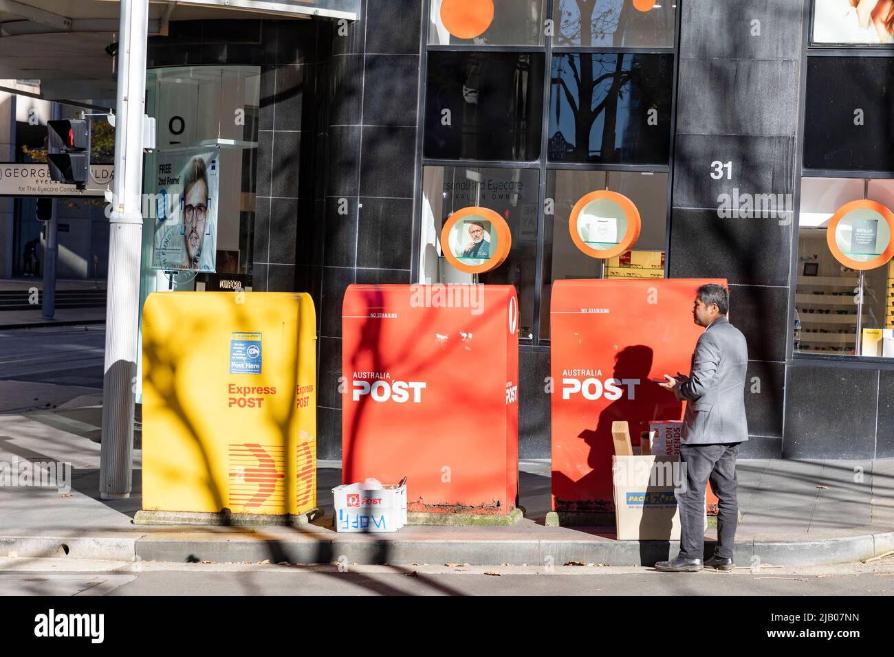 Australia Post mail boxes in Sydney city centre, yellow mailbox is for