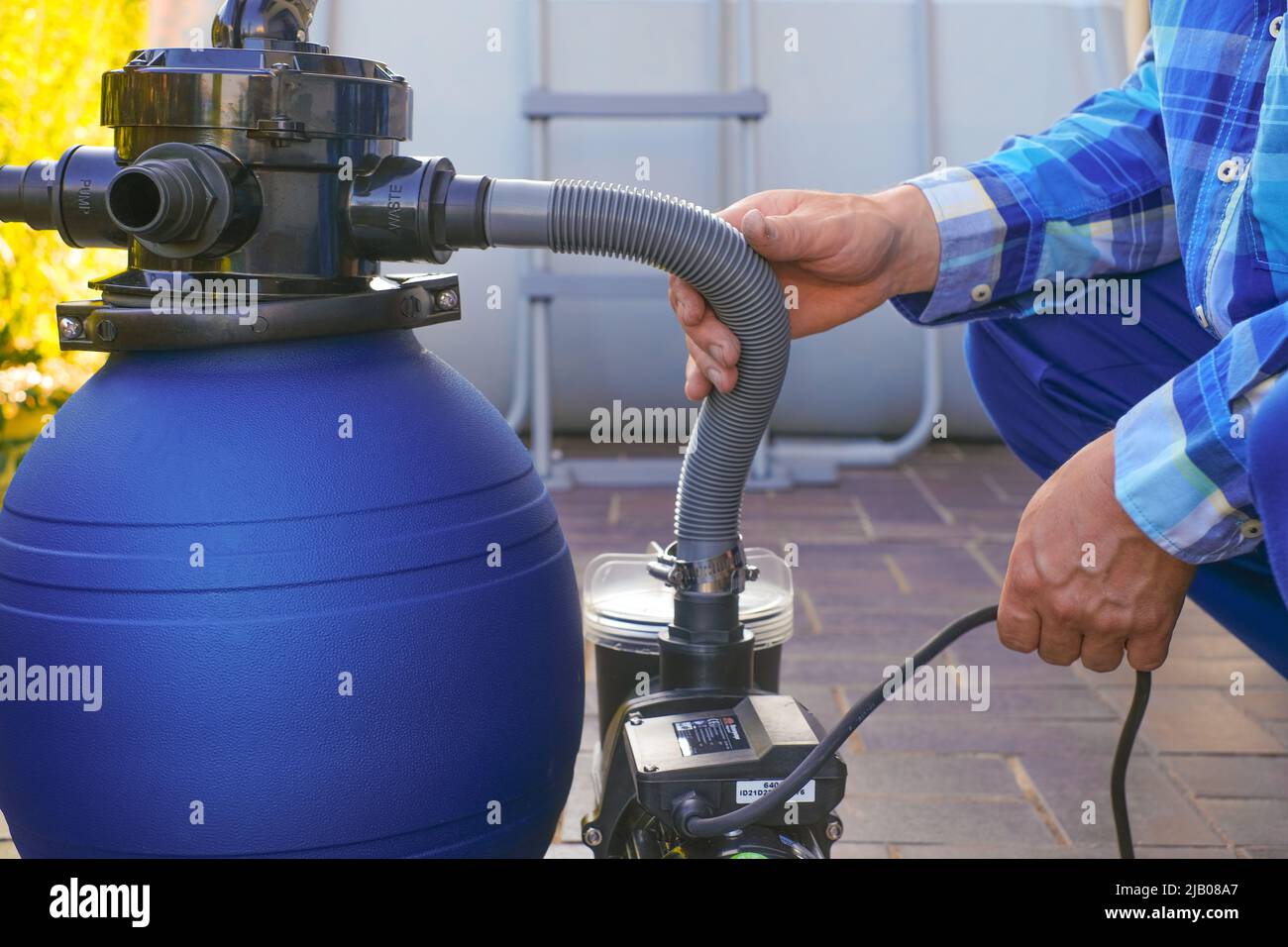 pool Filter. Swimming pool cleaning equipment on terrace near the house