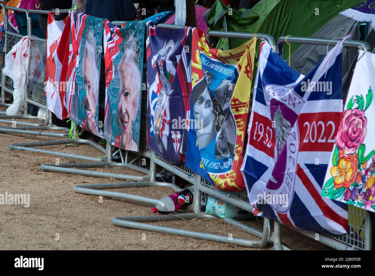 London, UK. Ist June 2022. Barriers have been decorated with flags as Royal fans have come to the Mall to save a prime spot for tomorrow's Platinum Jubilee event to celebrate Queen Elizabeth II's 70 years on the throne. Credit: Kiki Streitberger / Alamy Live News Stock Photo