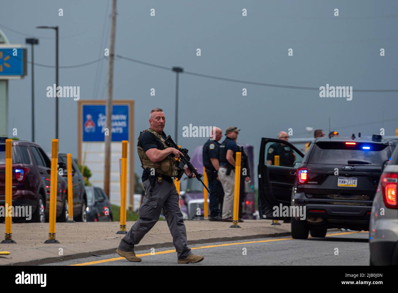 Pittston, United States. 01st June, 2022. A police officer carries a