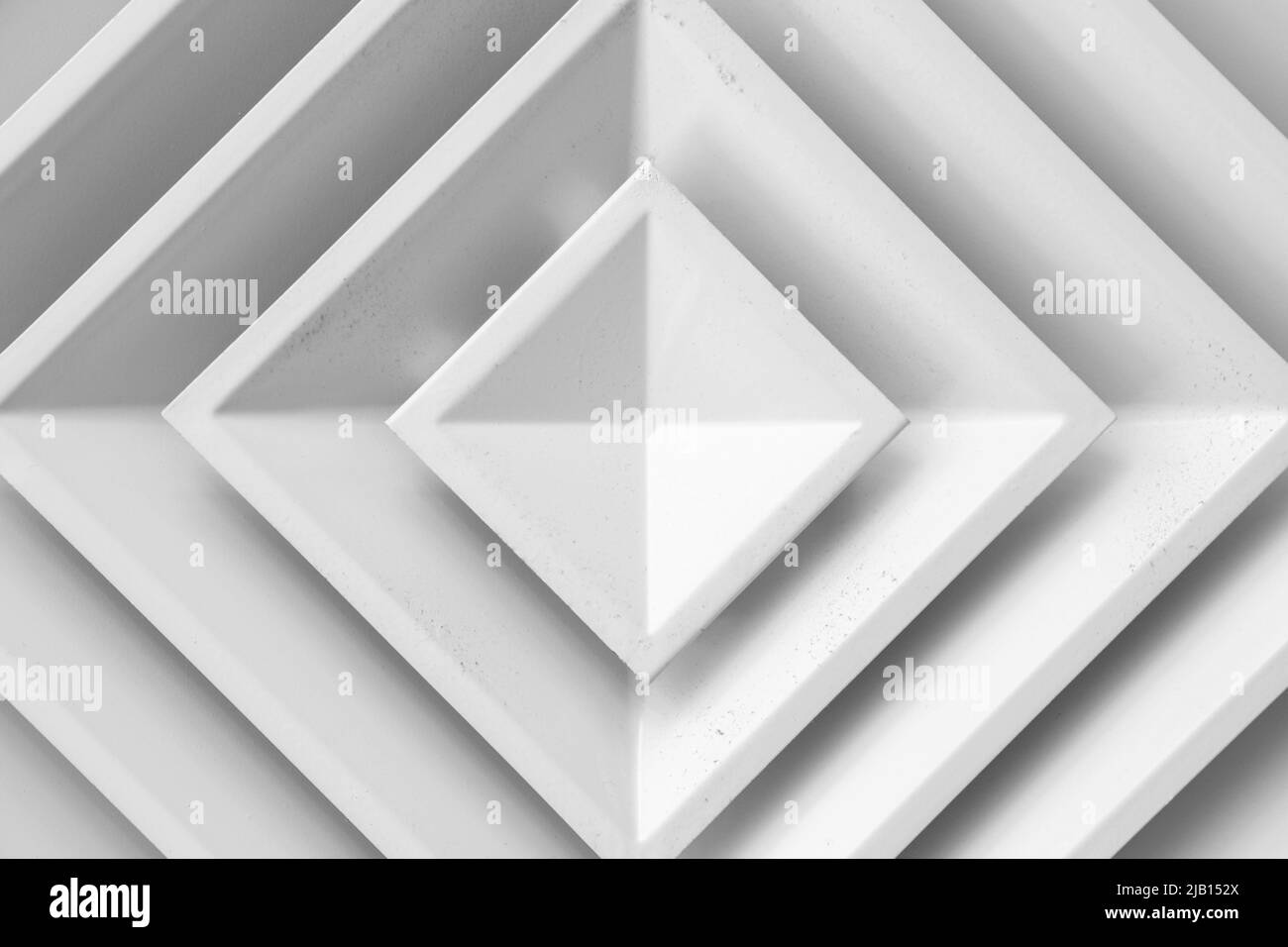Square white ceiling ventilation diffuser close up photo Stock Photo