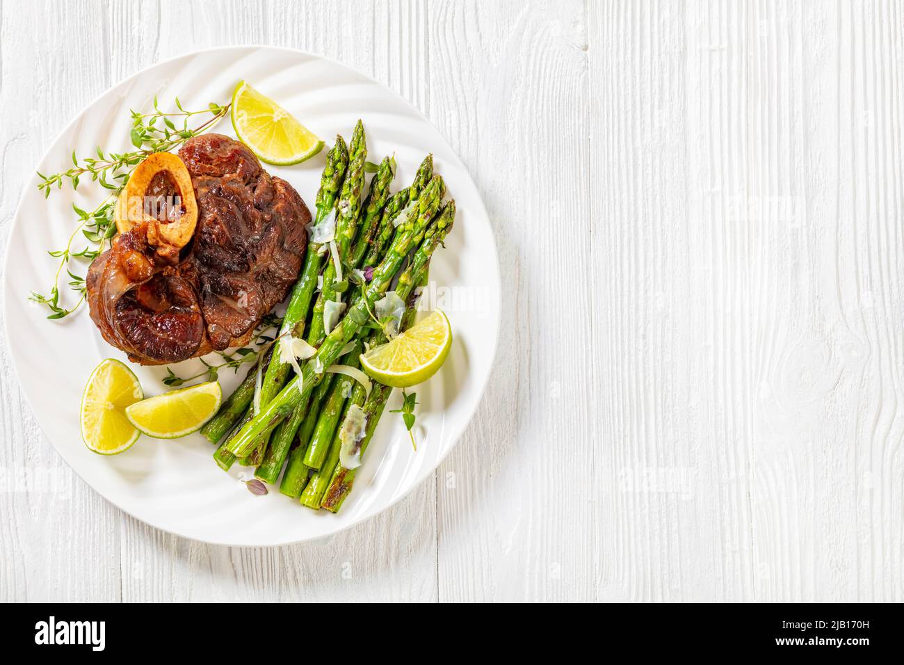 braised osso buco, veal shank steak with grilled asparagus, lime and