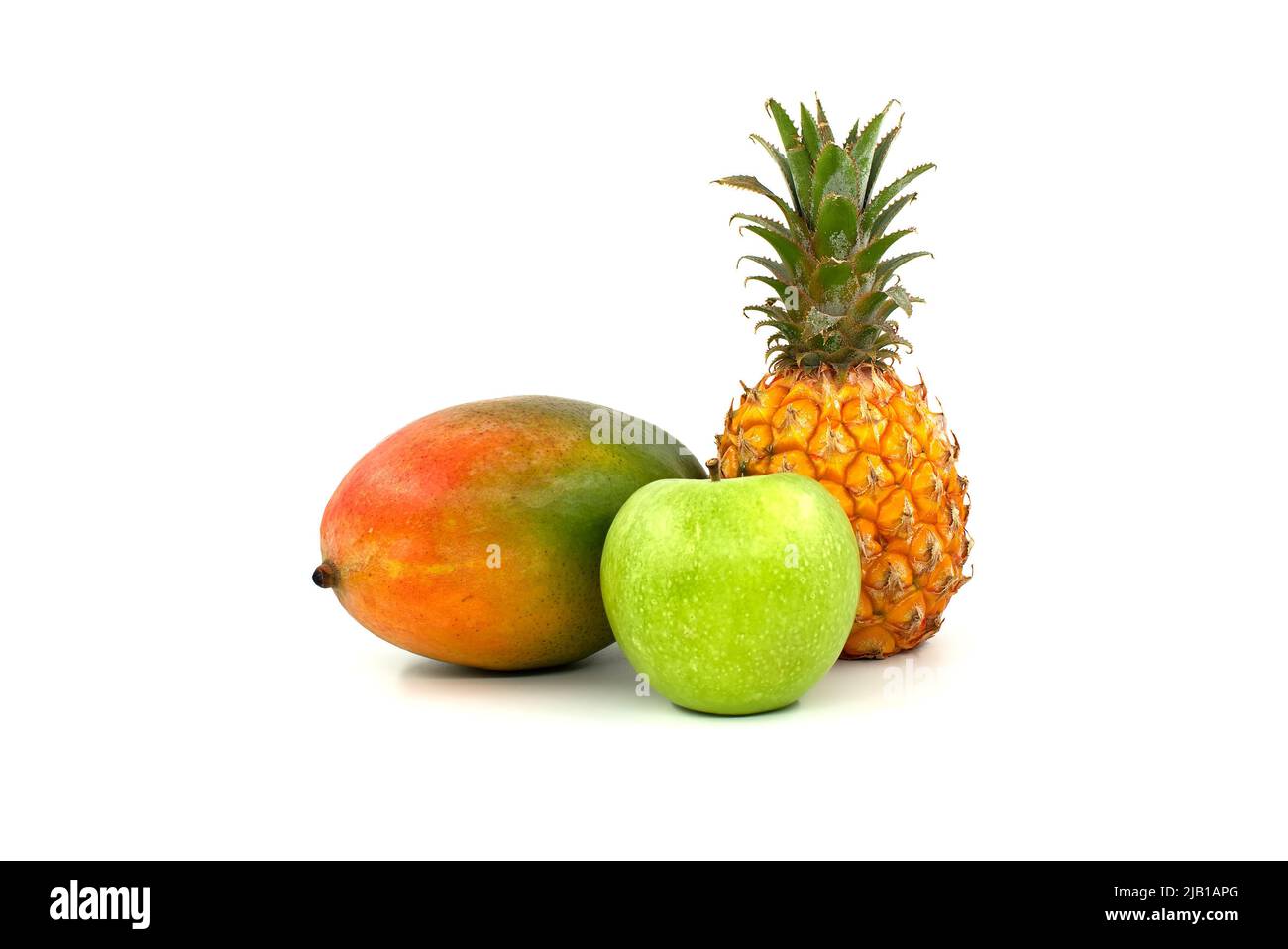 Whole mango, pineapple fruit and apple isolated on a white background Stock Photo