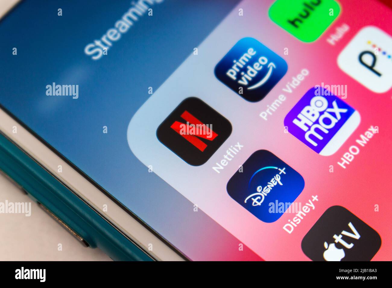 Netflix, US subscription streaming company, with popular streaming apps (Prime Video, Hulu, Disney plus, HBO Max, Peacock & Apple TV plus) on iPhone Stock Photo