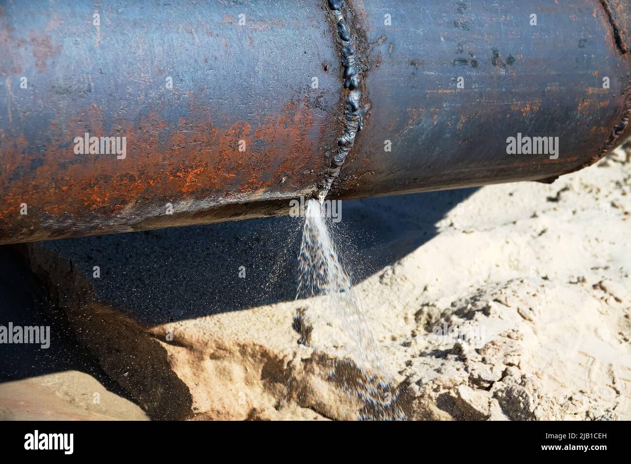 The water broke through an iron water pipe (busted water main). Lack of