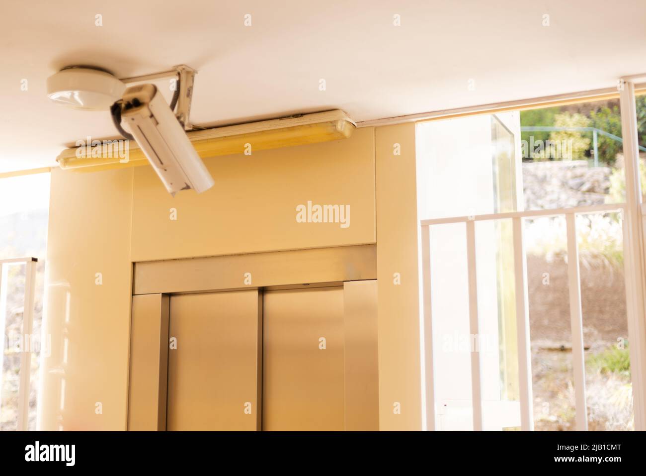 Security and video control camera near elevator door Stock Photo Alamy