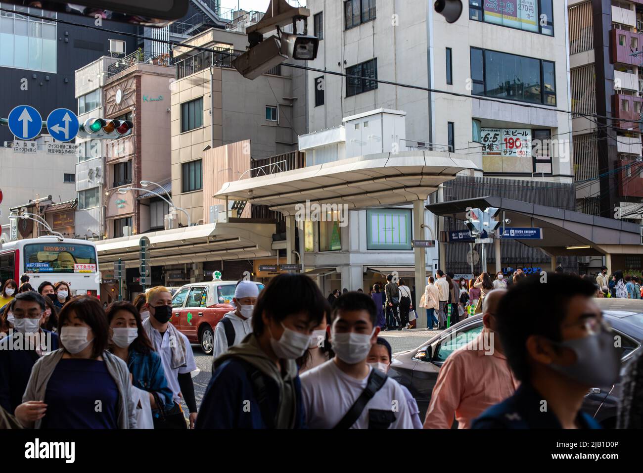 Kawaramachi dori Street near the Kyoto-Kawaramachi Station and crowd of people in motion. People wears face mask to prevent the spread of COVID-19 Stock Photo