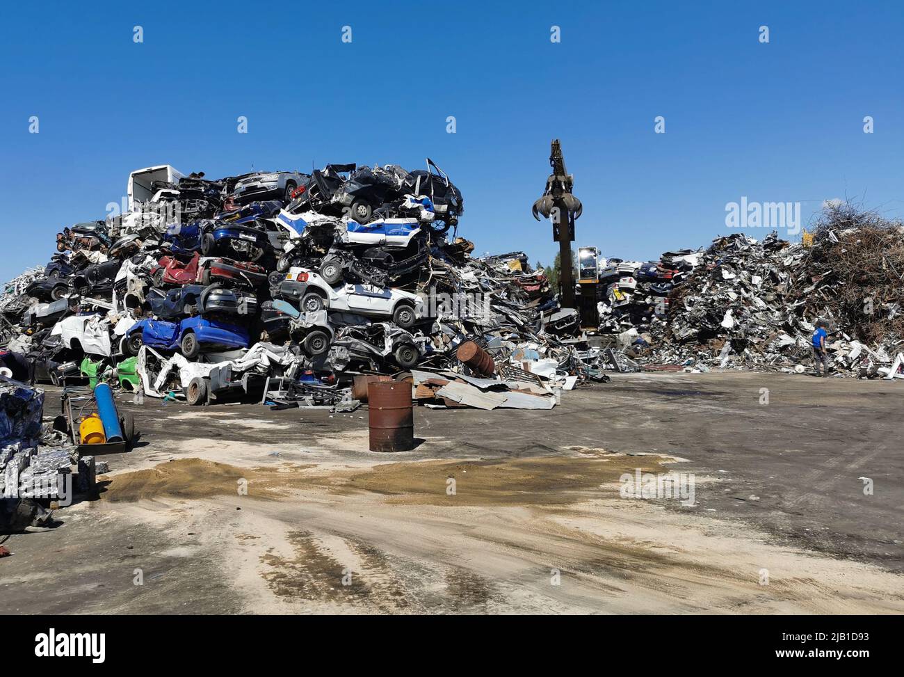 Pile of various scrap cars and other metals on a junk yard ready recycling industry. Stock Photo