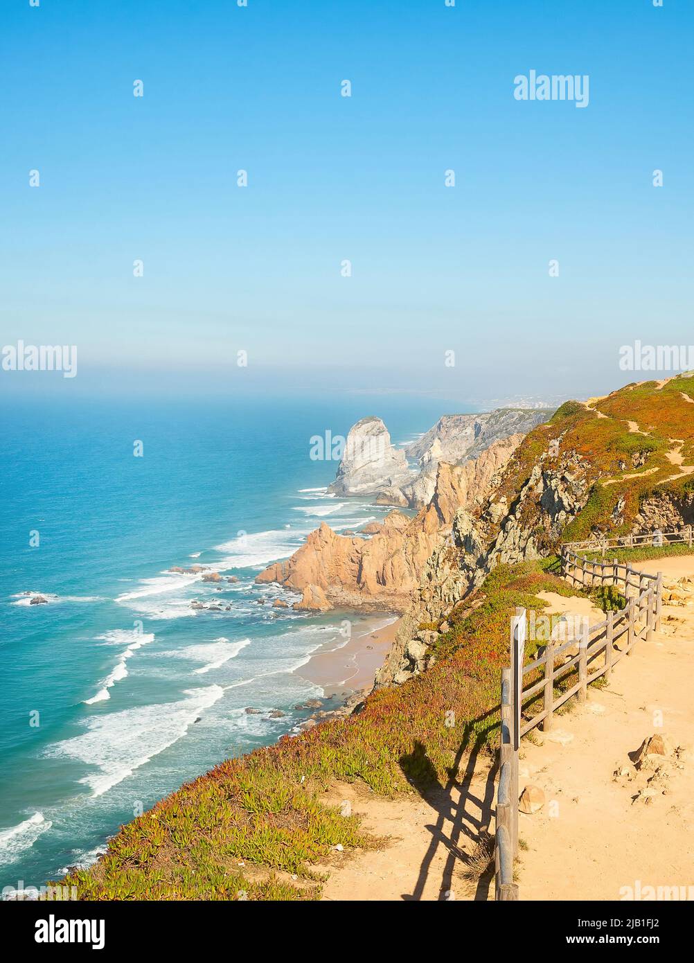 Sunshine seascape with Cabo da Roca lighthouse view, Portugal Stock Photo