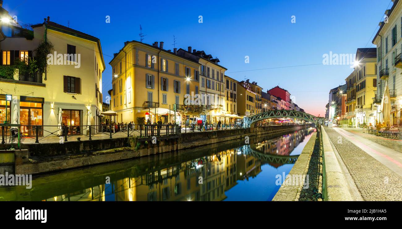 Milan Navigli Milano restaurant and bar district travel traveling holidays vacation town city blue hour panorama in Italy Stock Photo
