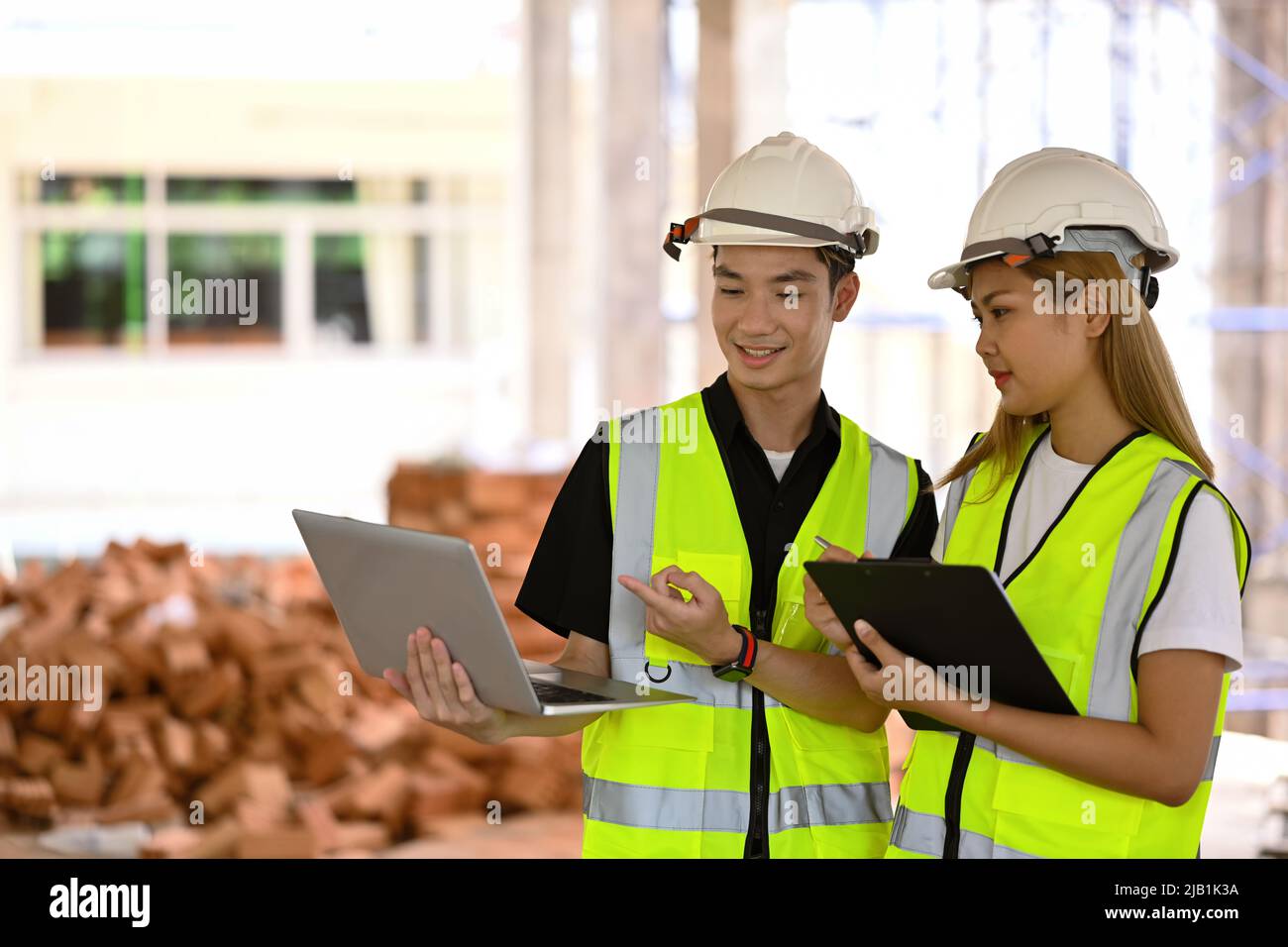 Female inspectors and architects discuss about construction project