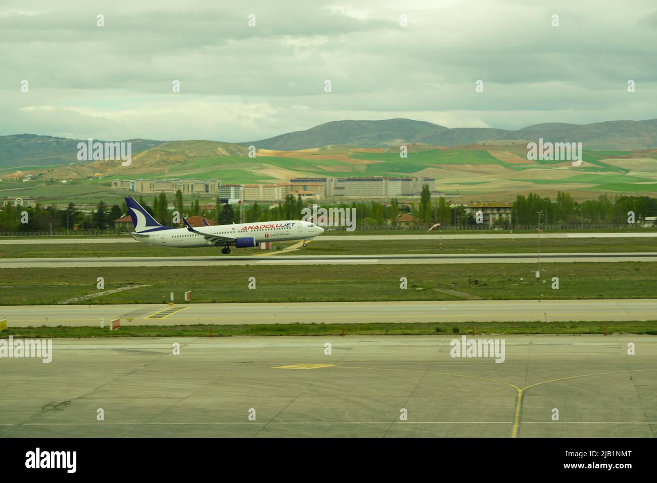 7 May 2022 Ankara Turkey. Anadolu jet boeing landing on Esenboga airport with smoking tires Stock Photo