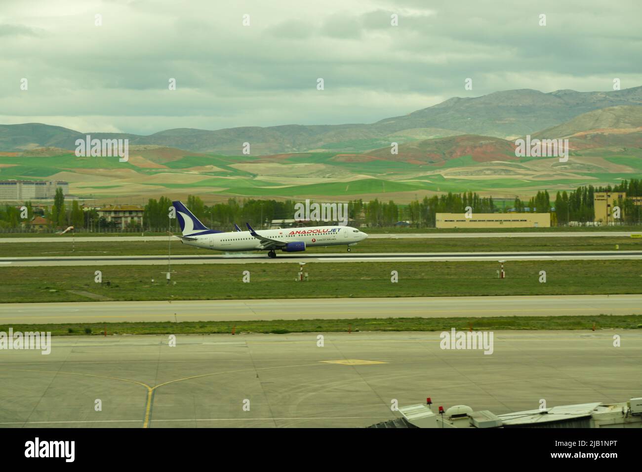 7 May 2022 Ankara Turkey. Anadolu jet boeing landing on Esenboga airport with smoking tires Stock Photo