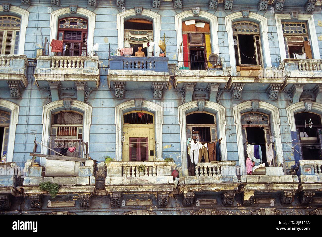 House facade with outhanging laundry, apartment house in the old city, Havana, Cuba, Caribbean Stock Photo