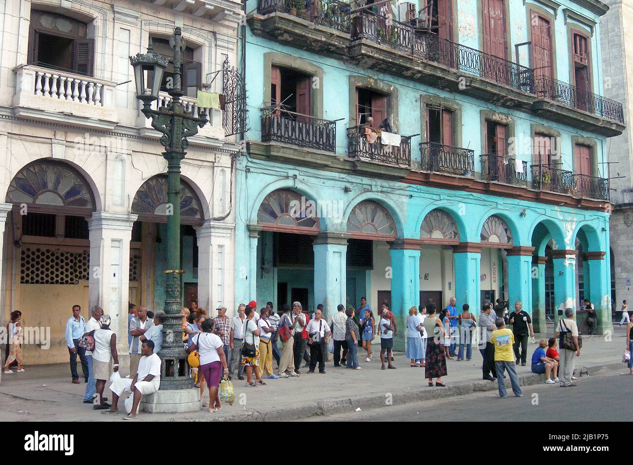 Local people waiting at a bus stop in the old city, Havana, Cuba, Caribbean Stock Photo