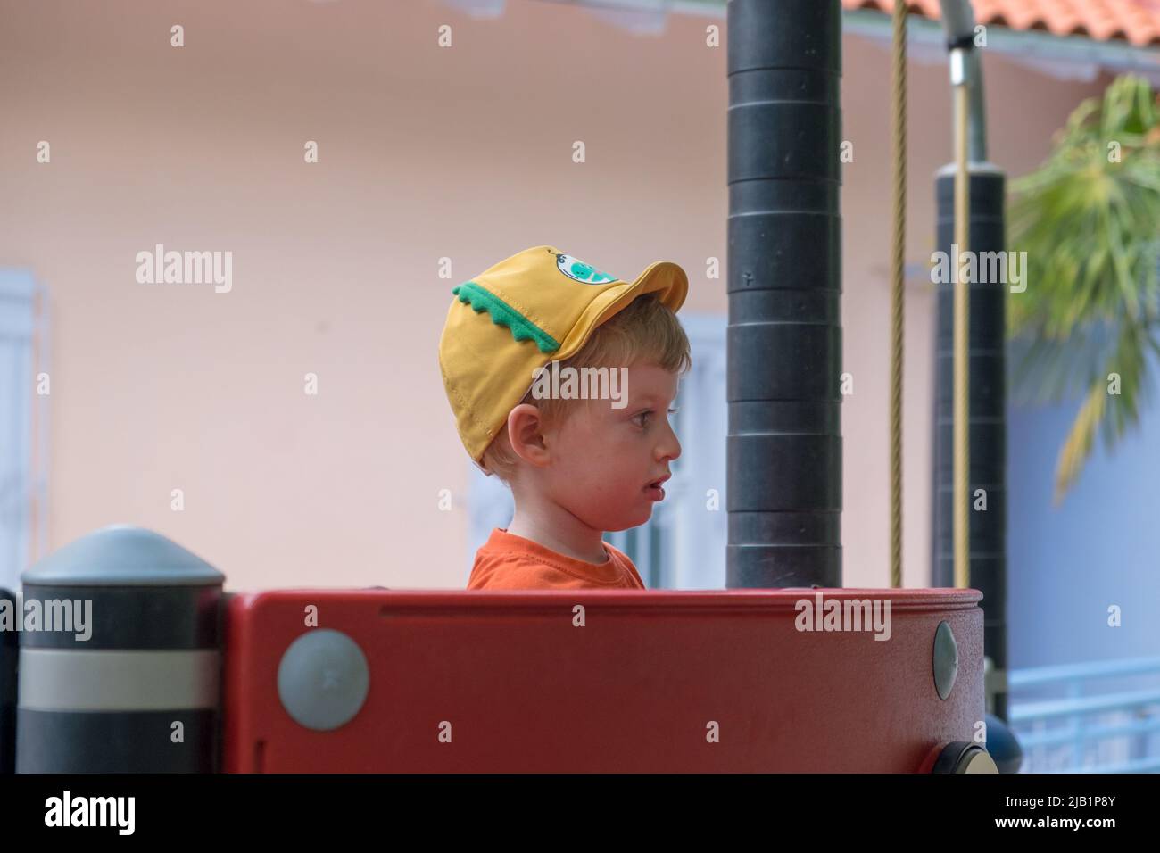 Cute little boy playing in the playground Stock Photo - Alamy