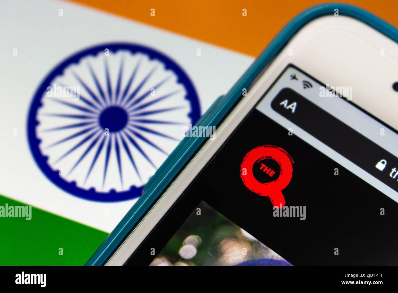 Kumamoto, JAPAN - Aug 26 2021 : India’s Hindi entertainment TV Channel the Q (QYOU Media) logo on iPhone on Indian flag. The QYOU is Influencer agency Stock Photo