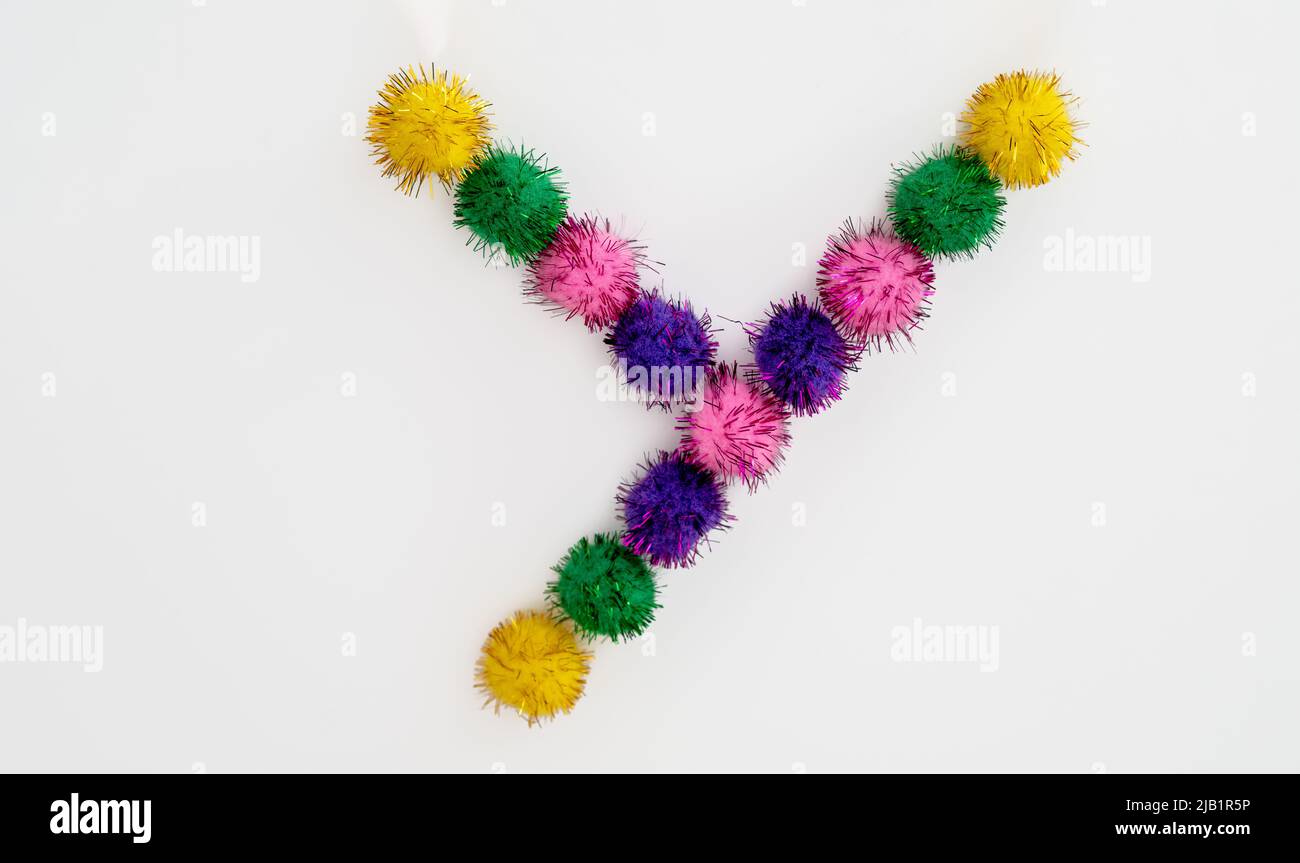 Children learning resources color pom poms on a white background Stock Photo