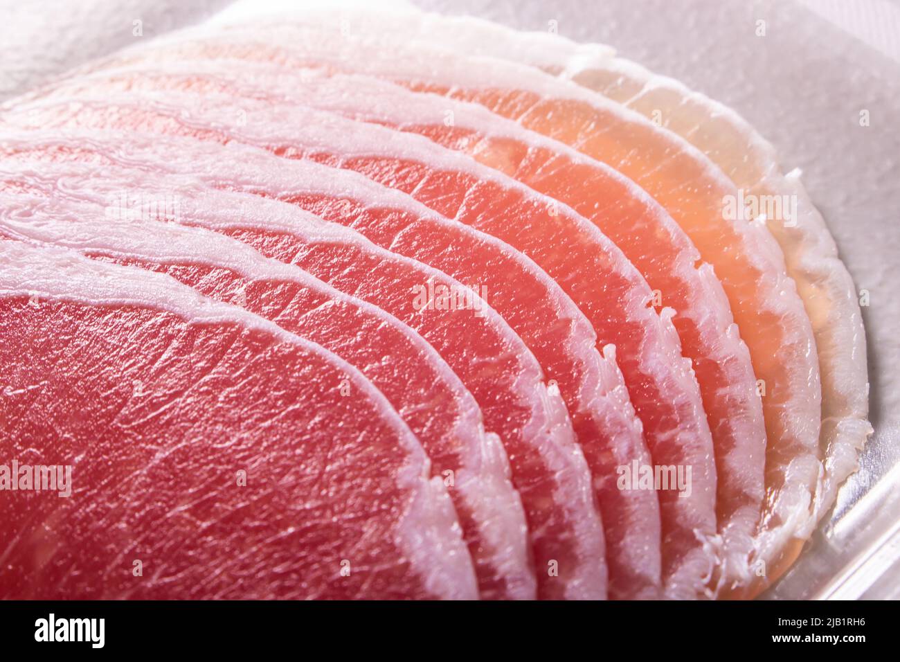 Closeup the slices of prosciutto, an Italian drycured ham(prosciutto