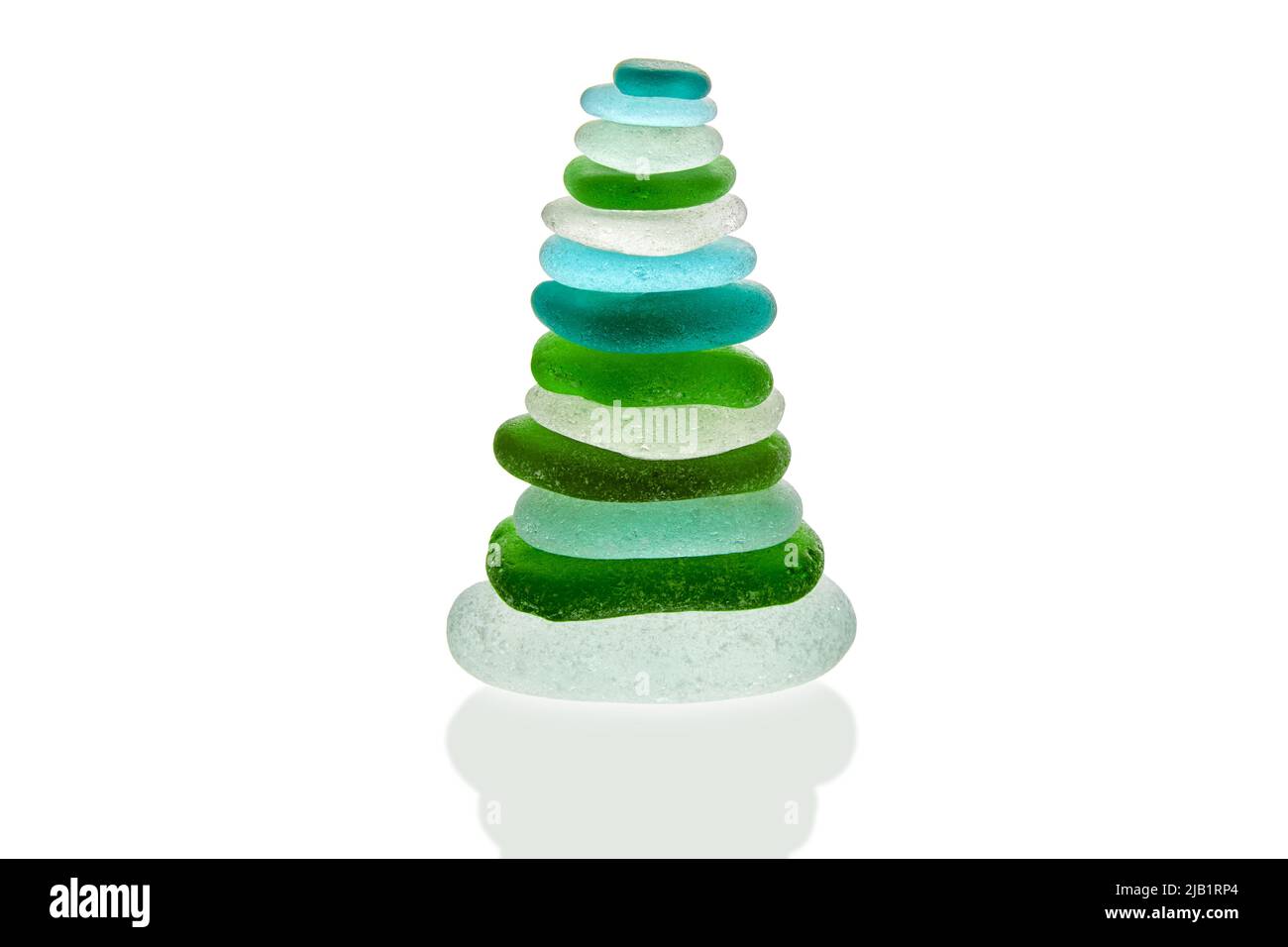 Pyramid made of cut green and blue sea glass. Zen stones Stock Photo