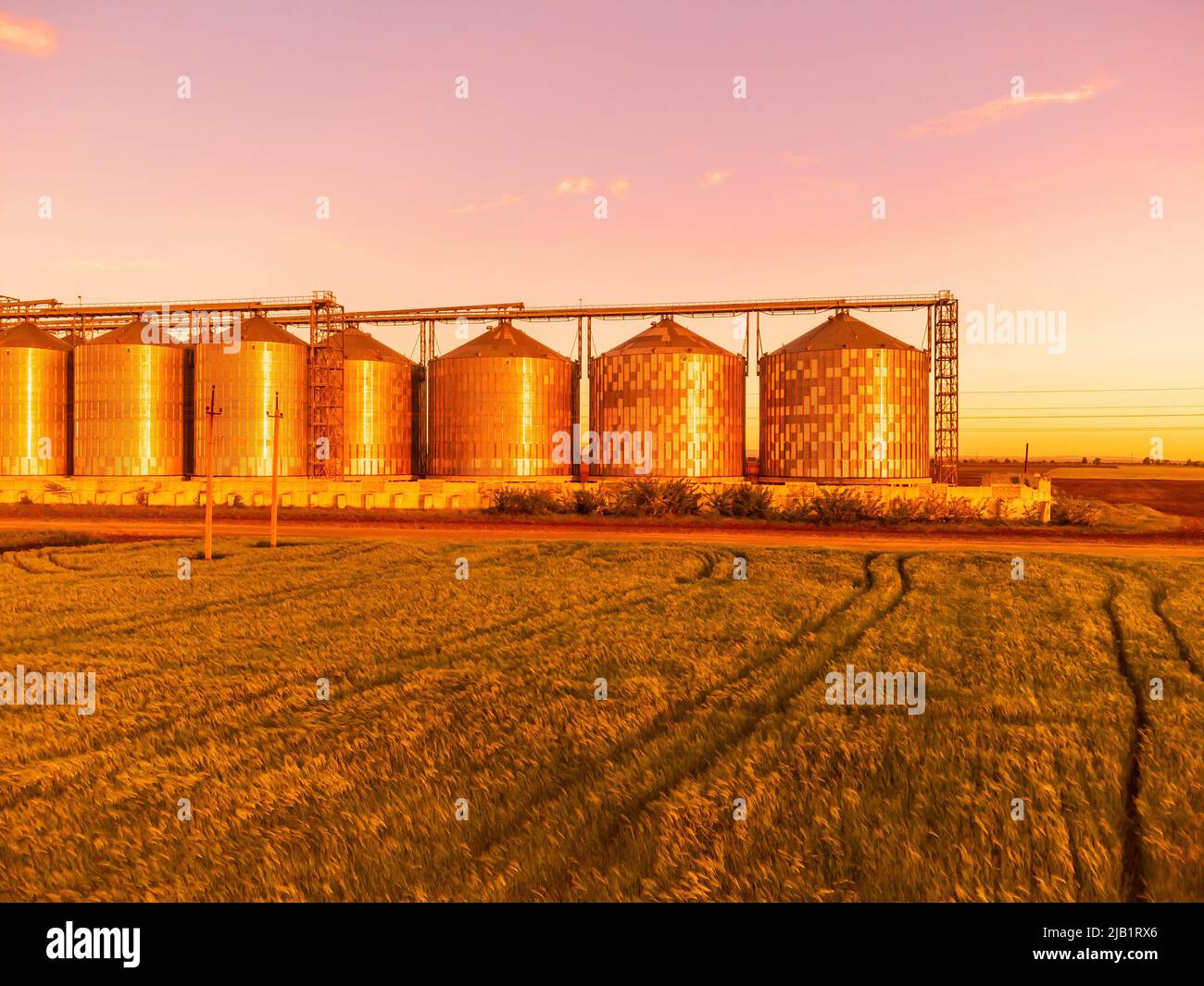 Grain elevator. Metal grain elevator in agricultural zone. Agriculture storage for harvest