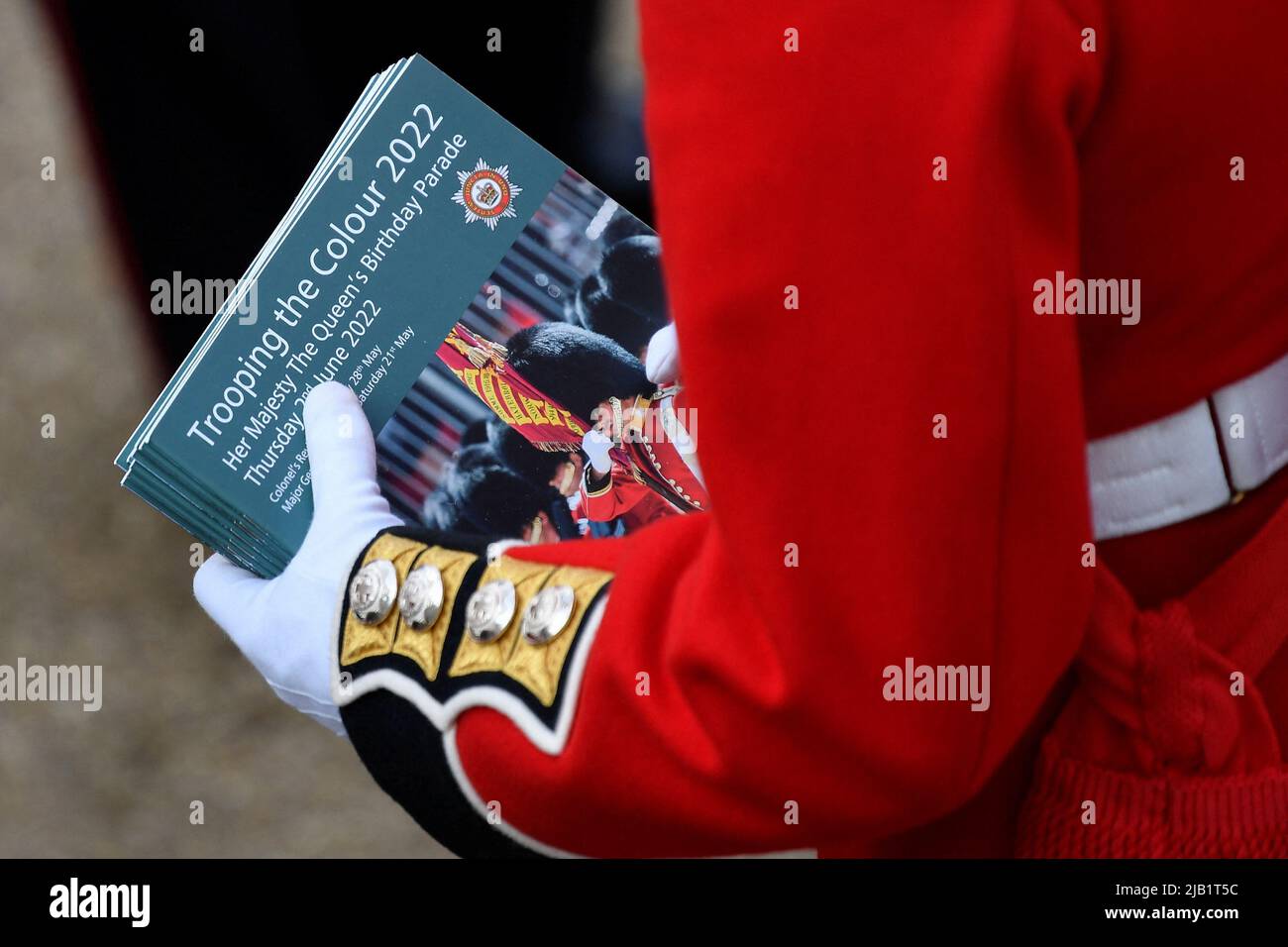 A member of the Coldstream Guards holds souvenir programs ahead of the Trooping the Colour ceremony at Horse Guards Parade, central London, as the Queen celebrates her official birthday, on day one of the Platinum Jubilee celebrations. Picture date: Thursday June 2, 2022. Stock Photo