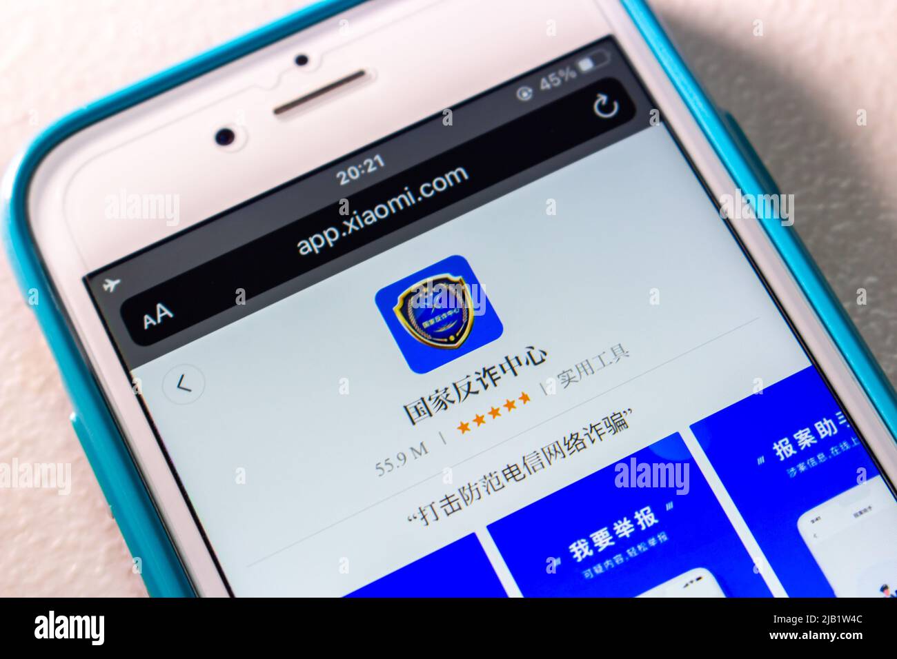 Kumamoto, JAPAN - Oct 25 2021 : Chinese anti-fraud app “National Anti-fraud Center” in Xiaomi’s App Store in iPhone on table Stock Photo
