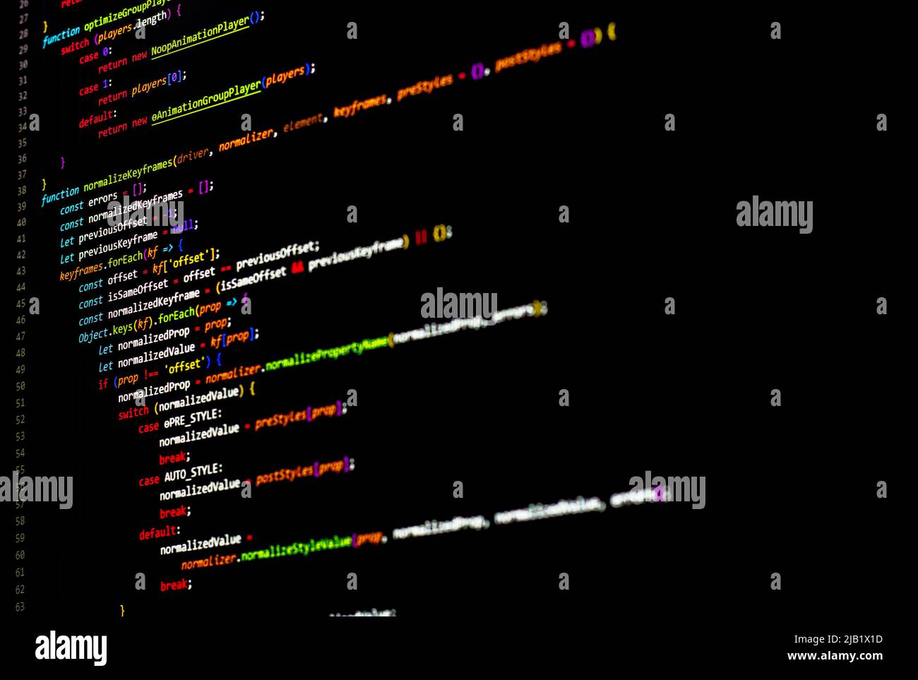 The software developer using dual screen is coding. Stock Photo