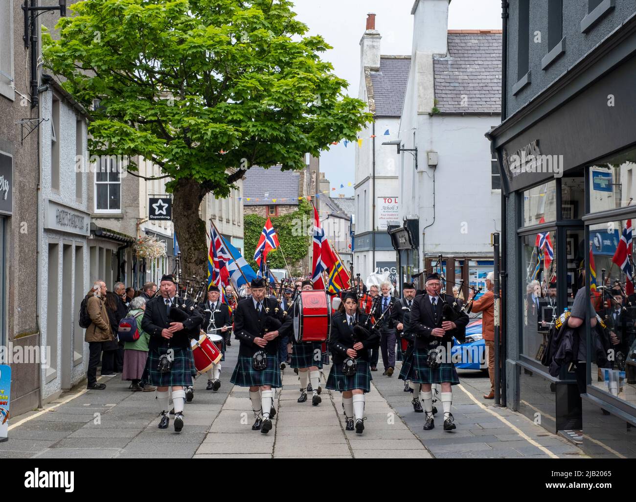 Kirkwall Orkney: Pipes and drums parade through Kirkwall town centre to celebrate Norway day on June 17th 2022. Stock Photo