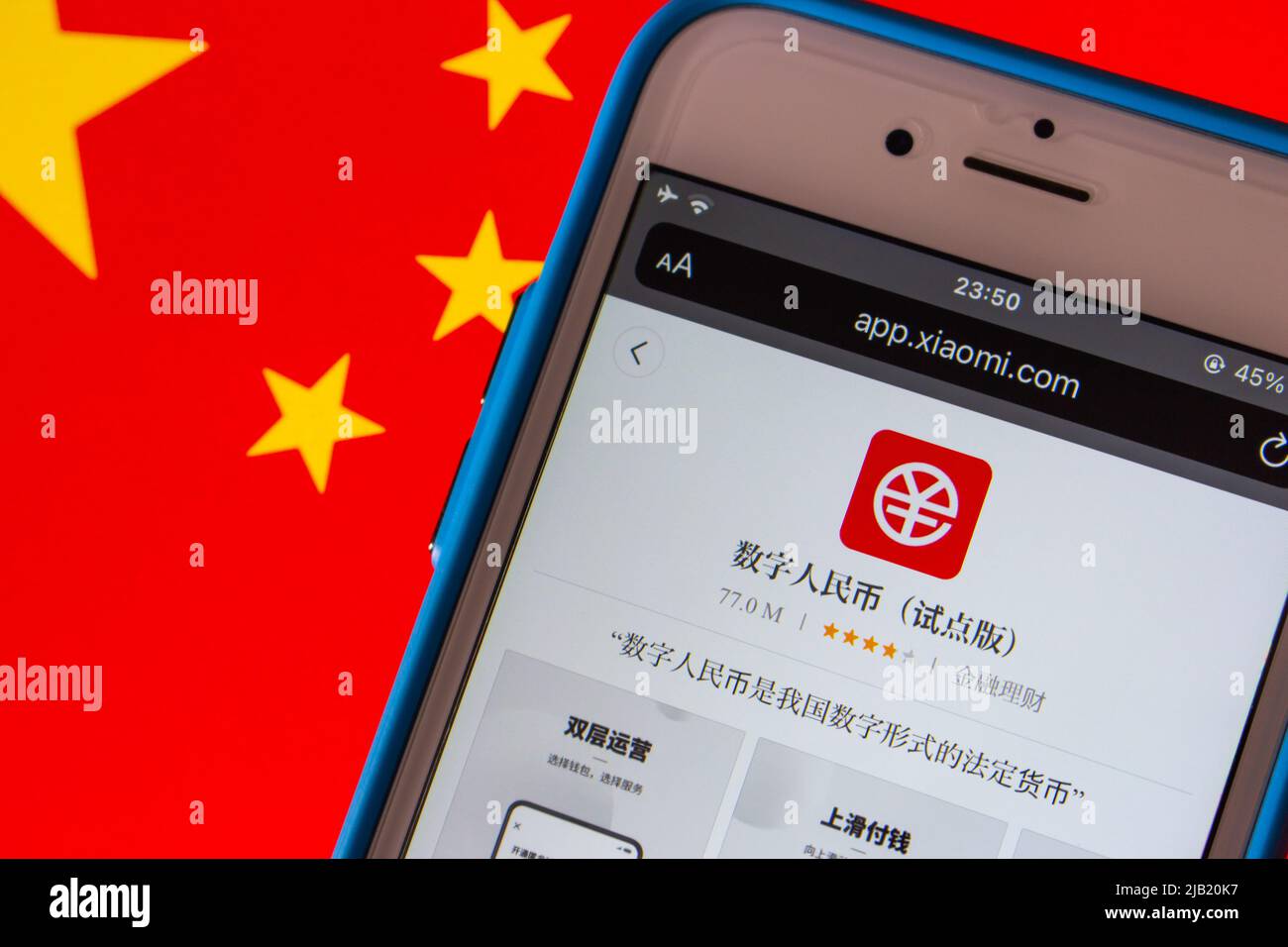 Digital Yuan app eCNY in Xiaomi’s App Store in iPhone on Chinese flag. Digital yuan is a form