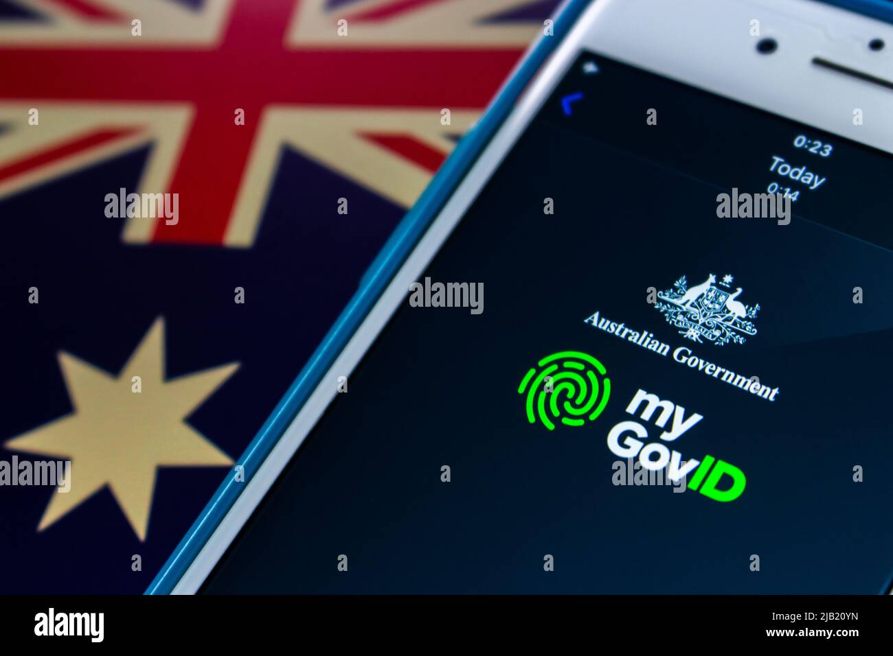 myGovID, the Australian Government's app that allows users to authenticate with Australian Government websites, on iPhone on the Australian flag Stock Photo