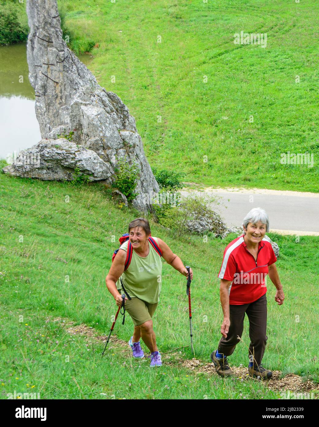 Good-humoured seniors hiking in idyllic nature Stock Photo