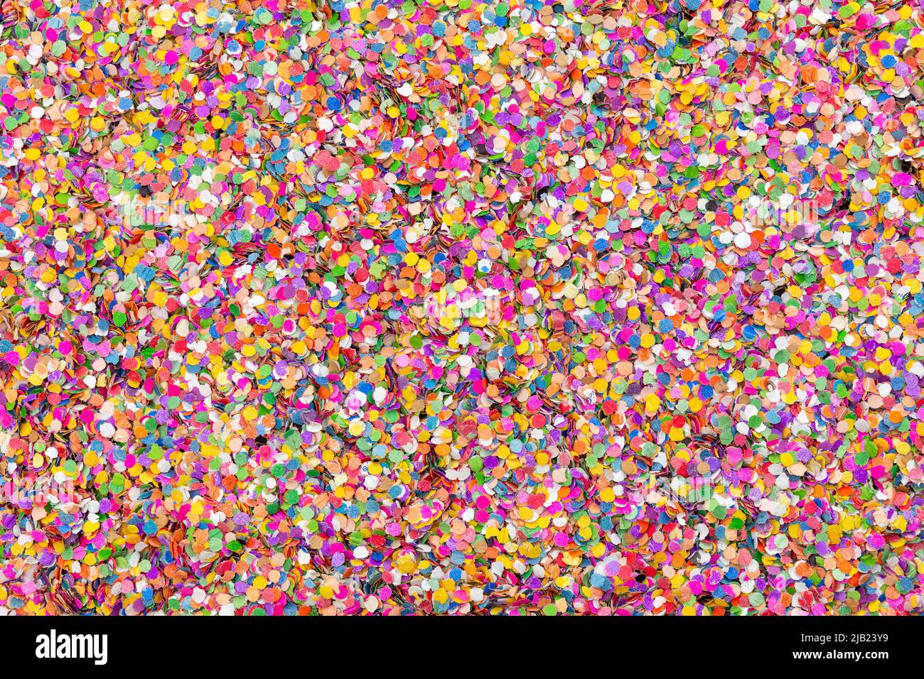 A Bed of Colorful Paper Confetti - small pieces of colored paper