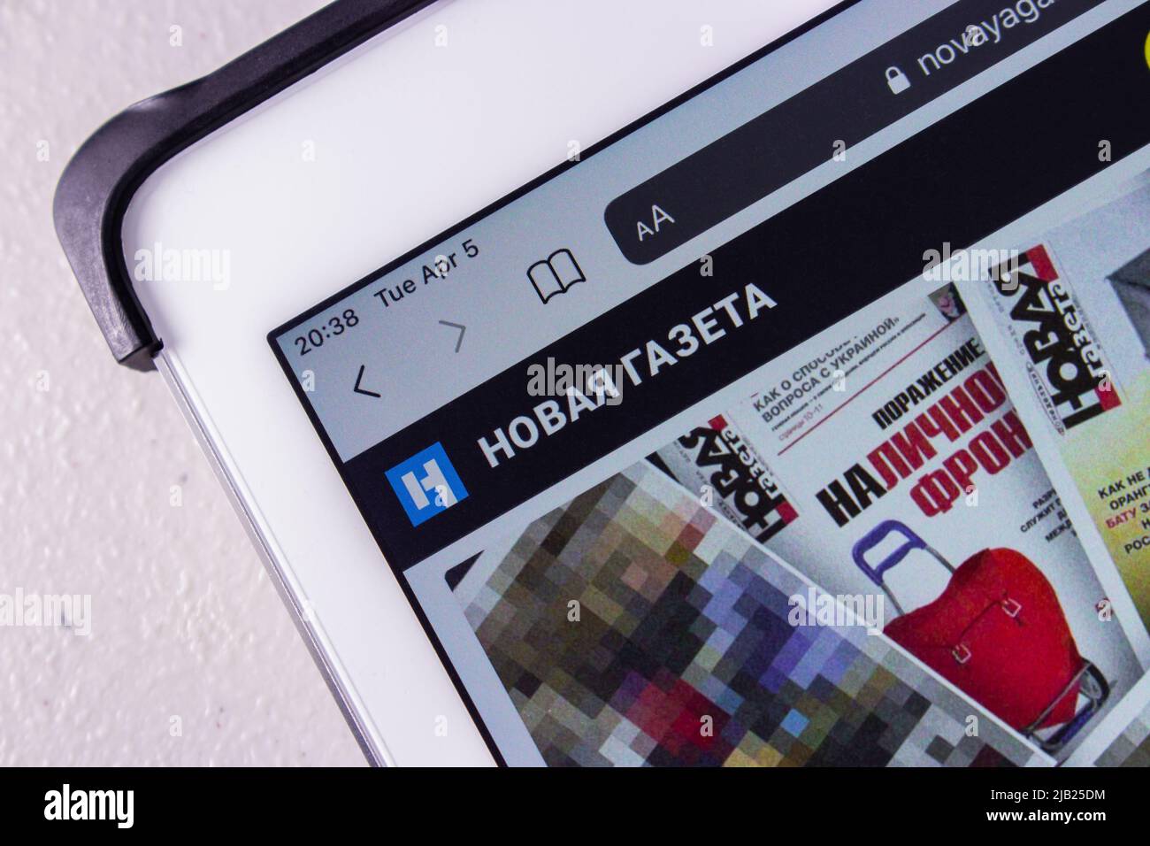 The logo of Novaya Gazeta on its website (novayagazeta.ru) on a tablet ...