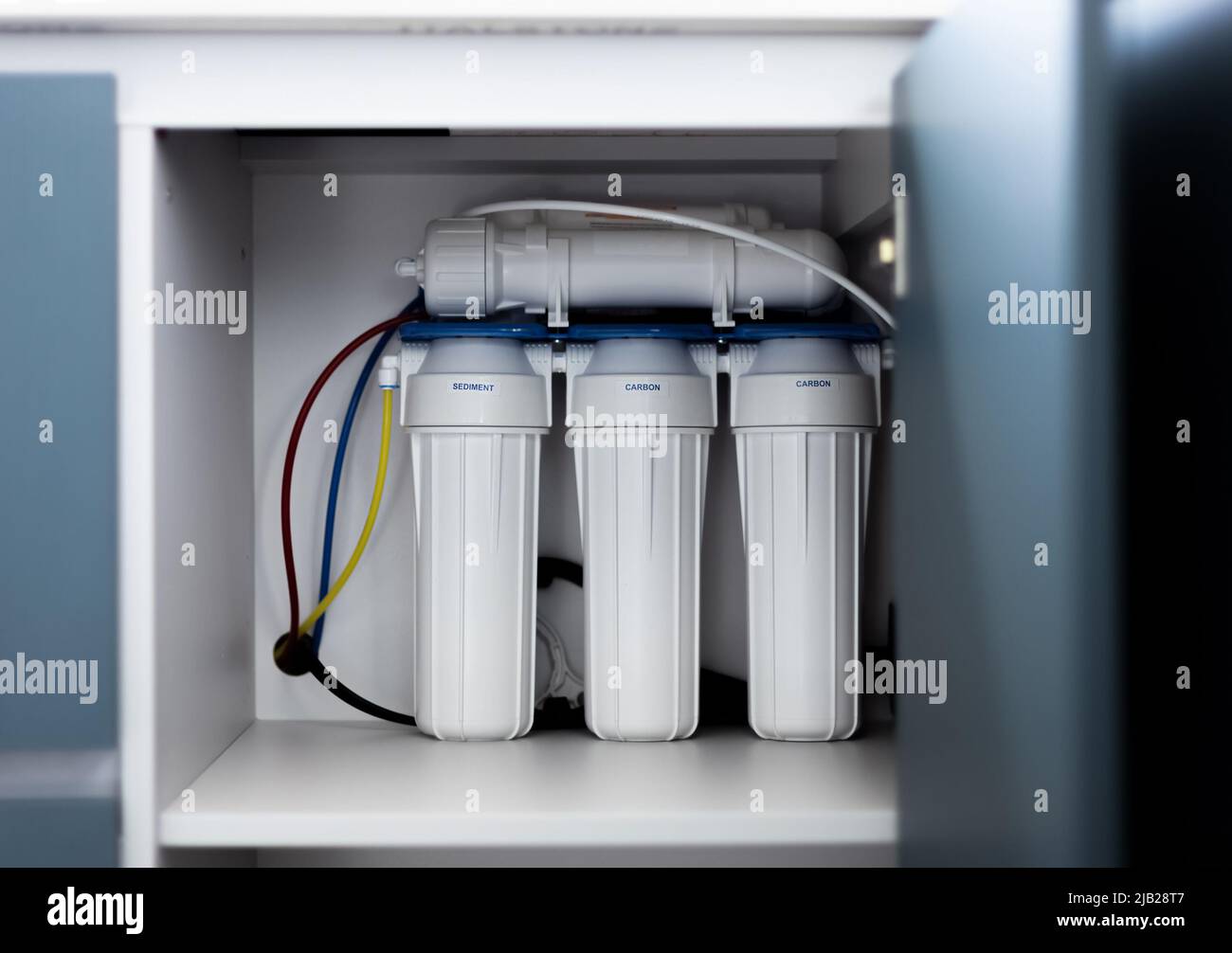 Four-stage water filtration system. Reverse osmosis filter. Stock Photo